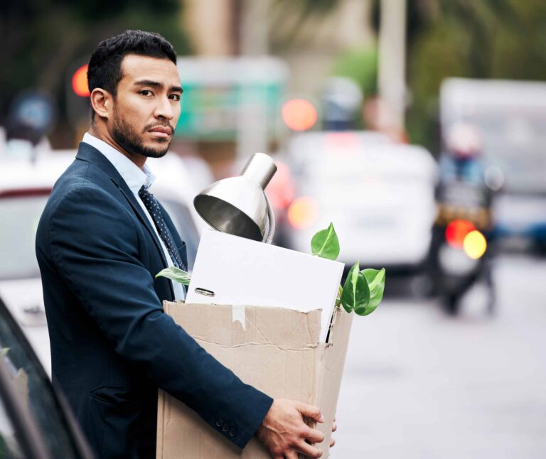 shot of a man carrying a cardboard box