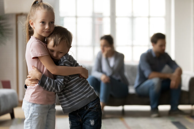 boy and girl hugging each other, upset children